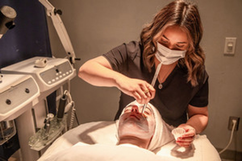 Esthetician with patient